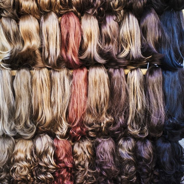 a display of hair extensions and hair pieces of different colours
