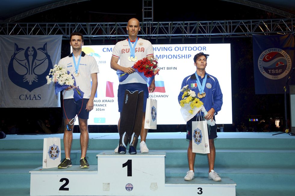 antalya, turkey   october 6   gold medalist  alexey molchanov of russia c, silver medalist arnaud jerald of france l and bronze medalist antonio mogavero of italy r pose for a photo after competing in men   constant weight bifin within the cmas 3rd free diving world championship   2018 outdoor in antalya, turkey on october 6, 2018 photo by ali riza akkiranadolu agencygetty images