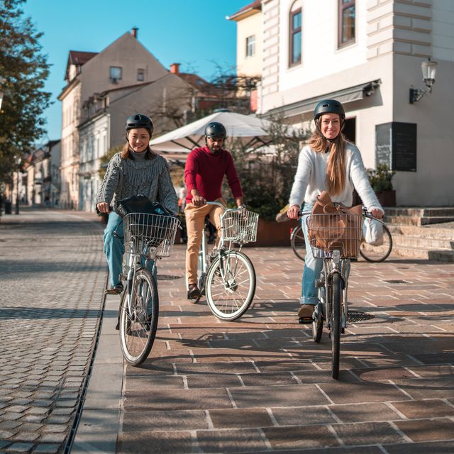 diverse group of friends enjoying a bike ride in urban setting