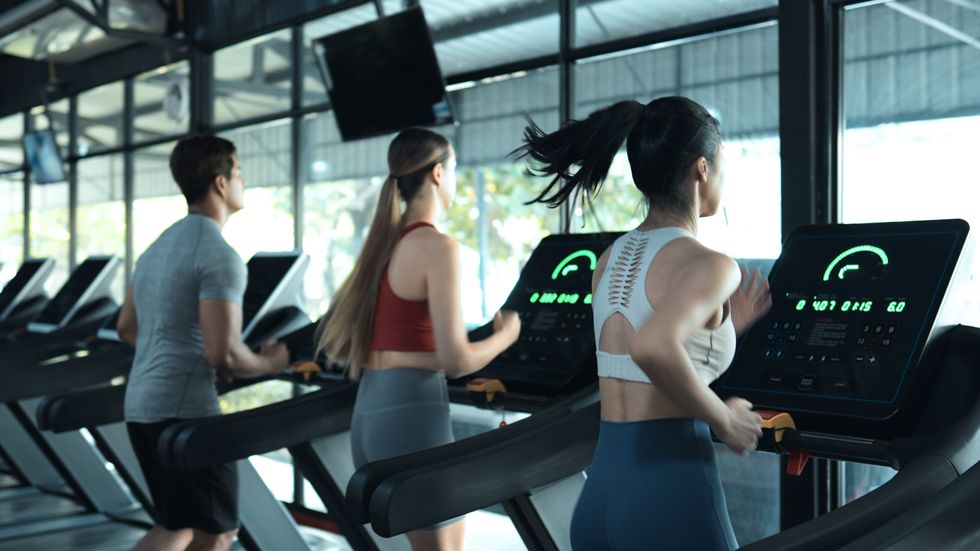 diverse people running on treadmill