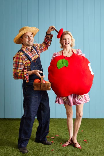 man and woman dressed as an apple picker and an apple