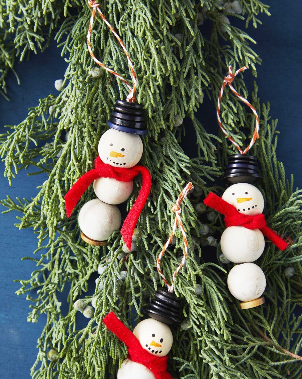 snowmen made from craft beads, button, and a felt scarf