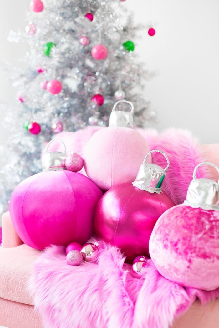 diy christmas gifts, large pink ornament shaped pillows on the couch