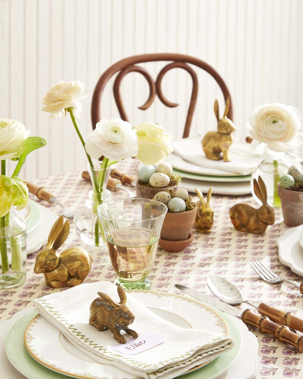 brass bunnies used as a centerpiece and placecards on an easter table
