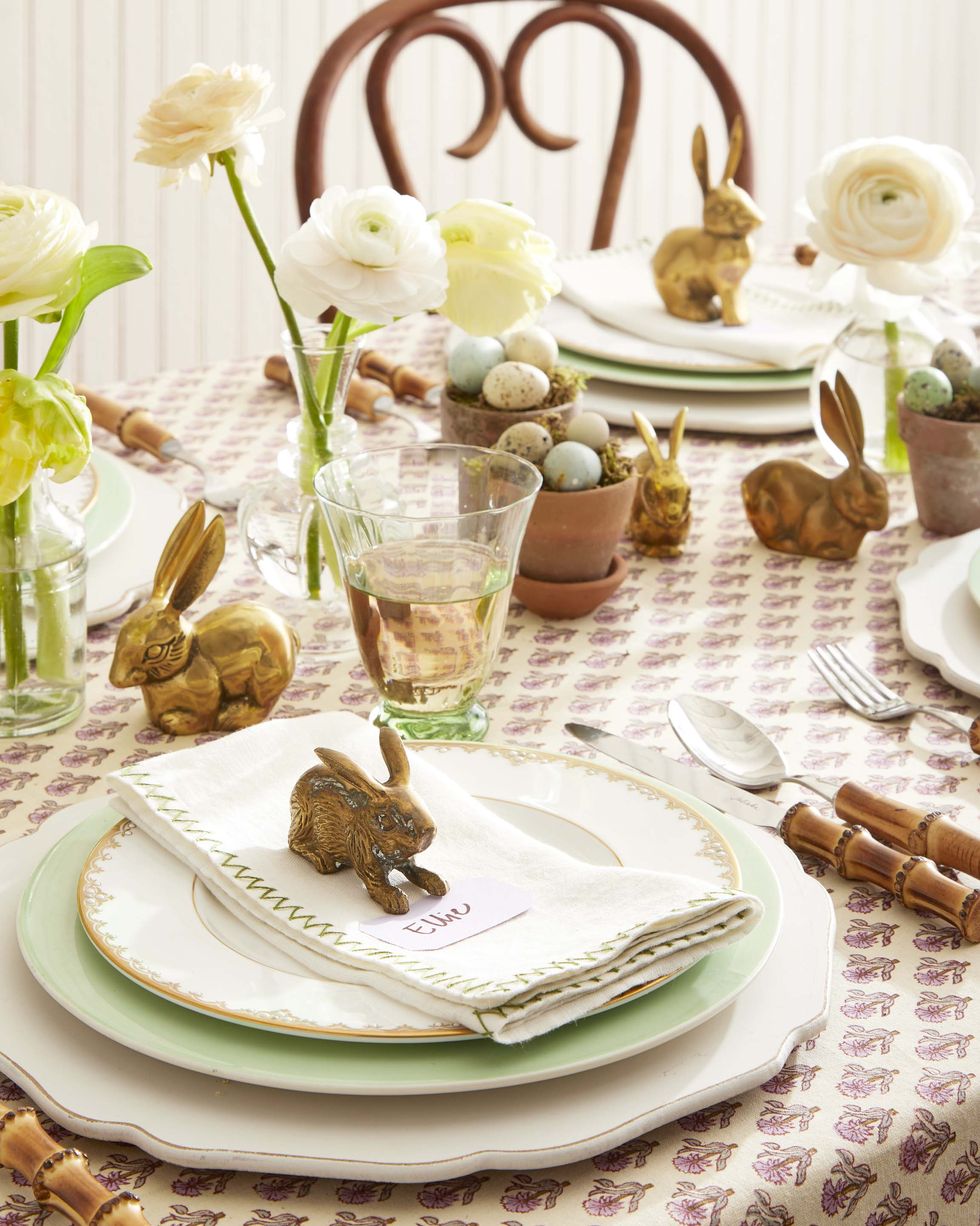 brass bunnies used as a centerpiece and placecards on an easter table