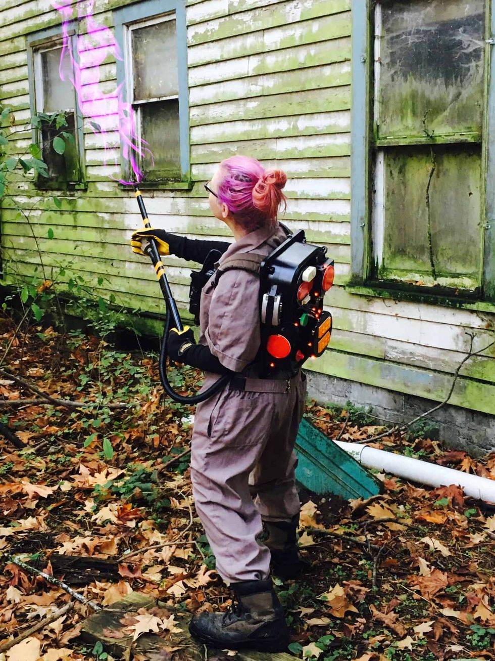 women's ghostbusters costume with a colored proton pack and gun
