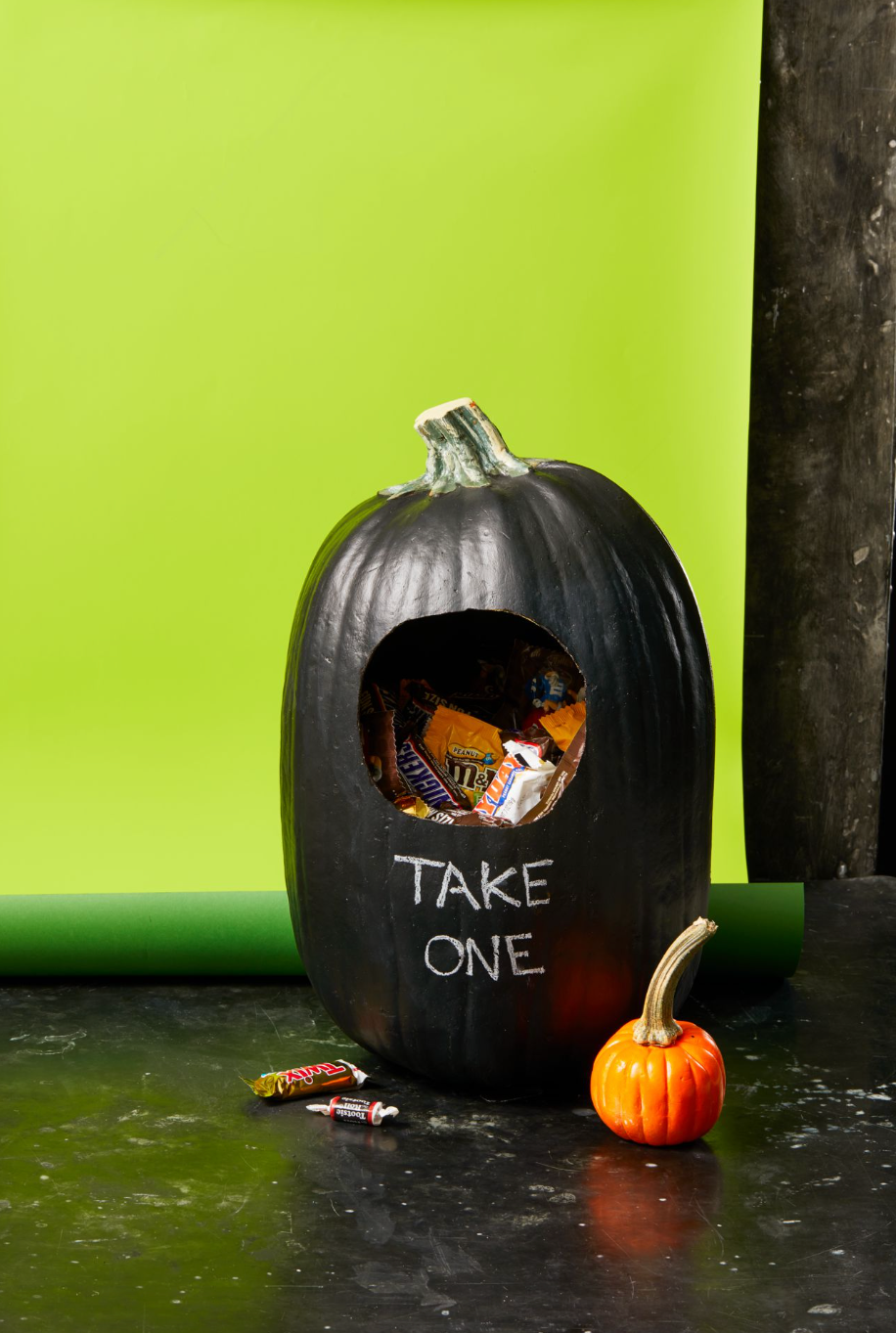 diy halloween decorations, black pumpkin with candy inside