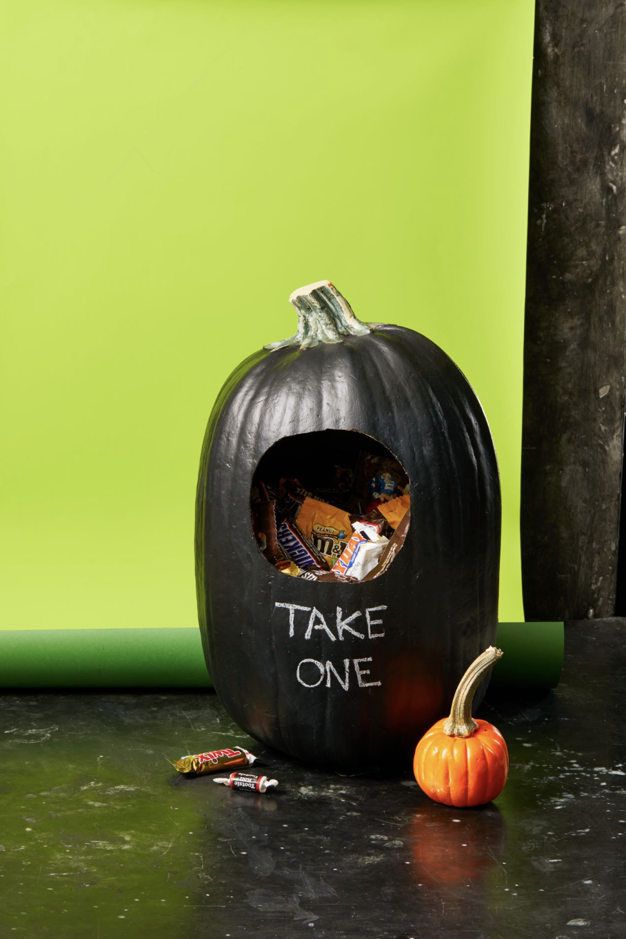 diy halloween decorations, black pumpkin with candy inside