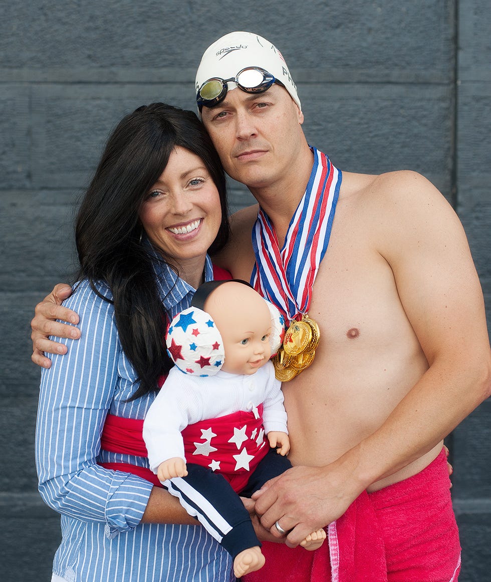 celebration of achievement with a gold medal and a baby doll