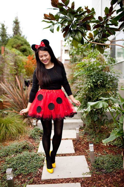 minnie mouse mom halloween costume with black tights and top, red tutu with black polka dots, yellow pumps, mouse ears