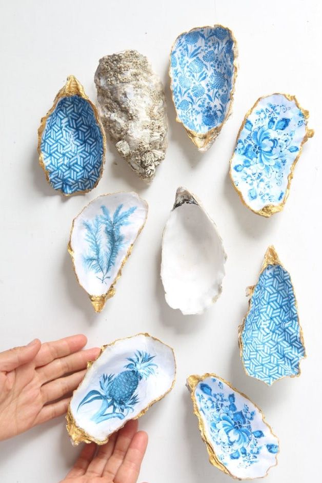 A selection of blue patterned trinket plates made from oyster shells