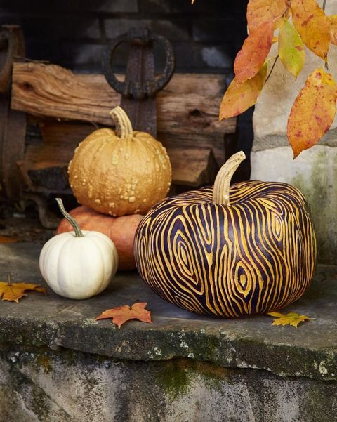 outdoor pumpkins decorated in faux bois style