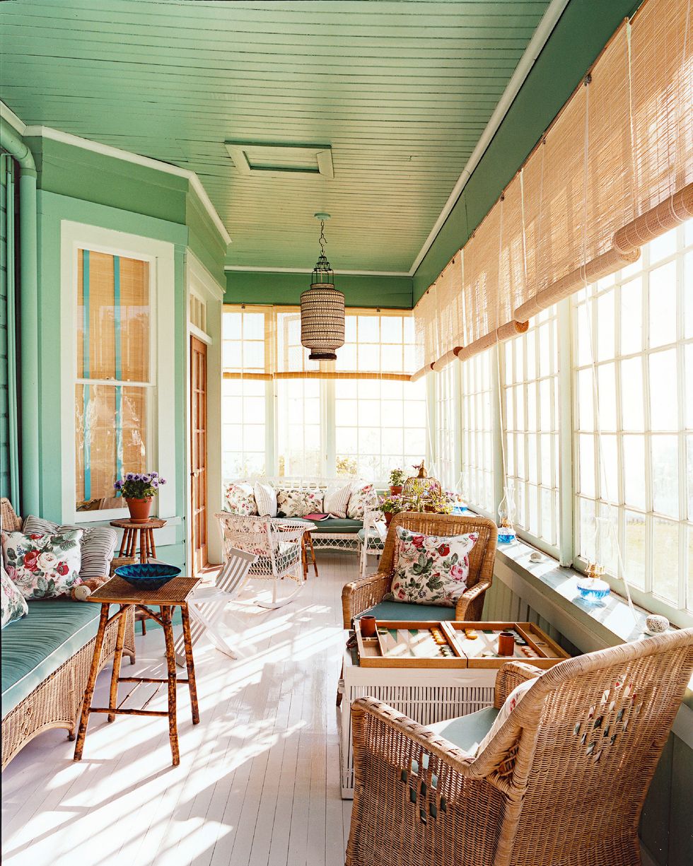 screened in porch with green painted ceiling