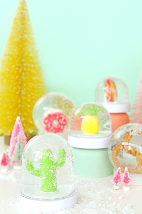 non traditional snow globes with cactus, donut, pineapple, pretzel, and hot dog