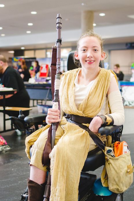 cosplayer dressed as rey from star wars at megacon convention in carlisle