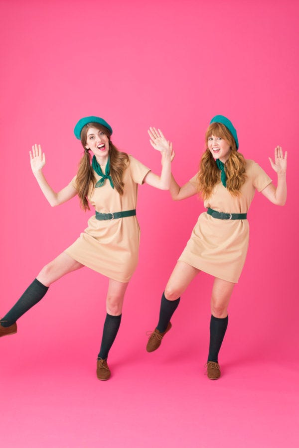 Two women dressed as wilderness girls