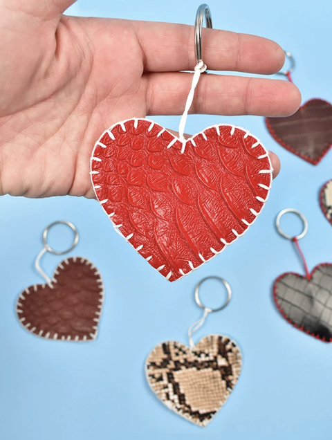 diy valentine gifts, hand holding a red heart key chain