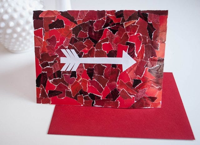 diy valentinecards, pieces of red recycled magazines with white arrow in the center