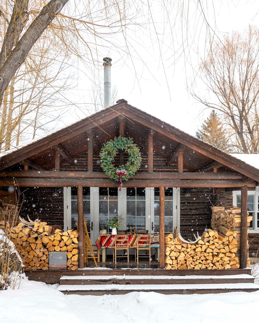 oversized wreath on the outside rafters of a cabin in the tetons