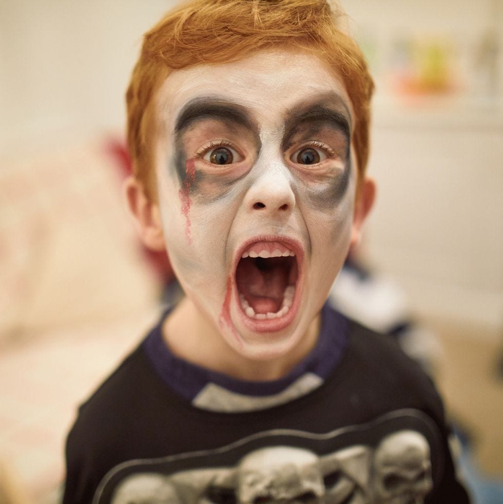 little boy dressed as zombie skeleton