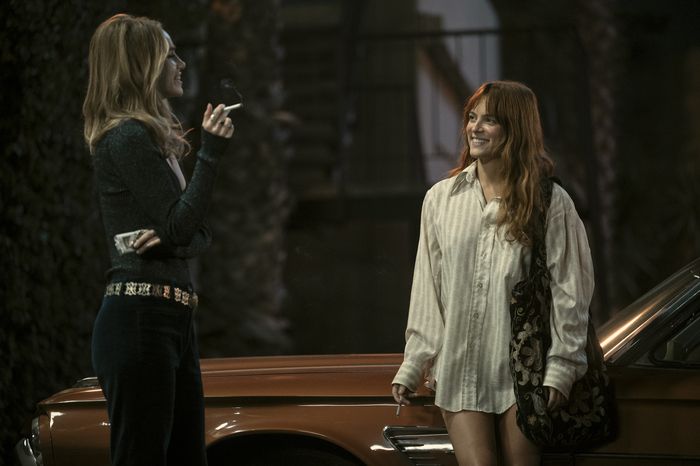 suki waterhouse karen, riley keough daisy wearing costumes that are used in a story about style in daisy jones and the six
