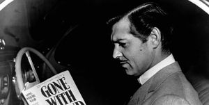 gone with the wind, clark gable reading a copy of gwtw in his car, 1939 