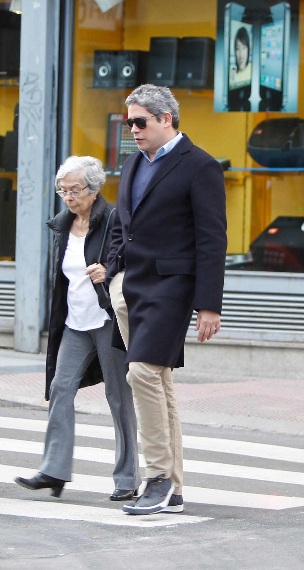 Standing, Suit, Snapshot, White-collar worker, Fashion, Footwear, Street fashion, Infrastructure, Outerwear, Photography, 