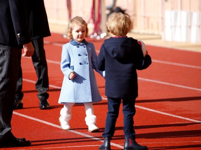 Child, Footwear, Uniform, Recreation, Flooring, Shoe, Gesture, Sport venue, Walking, 