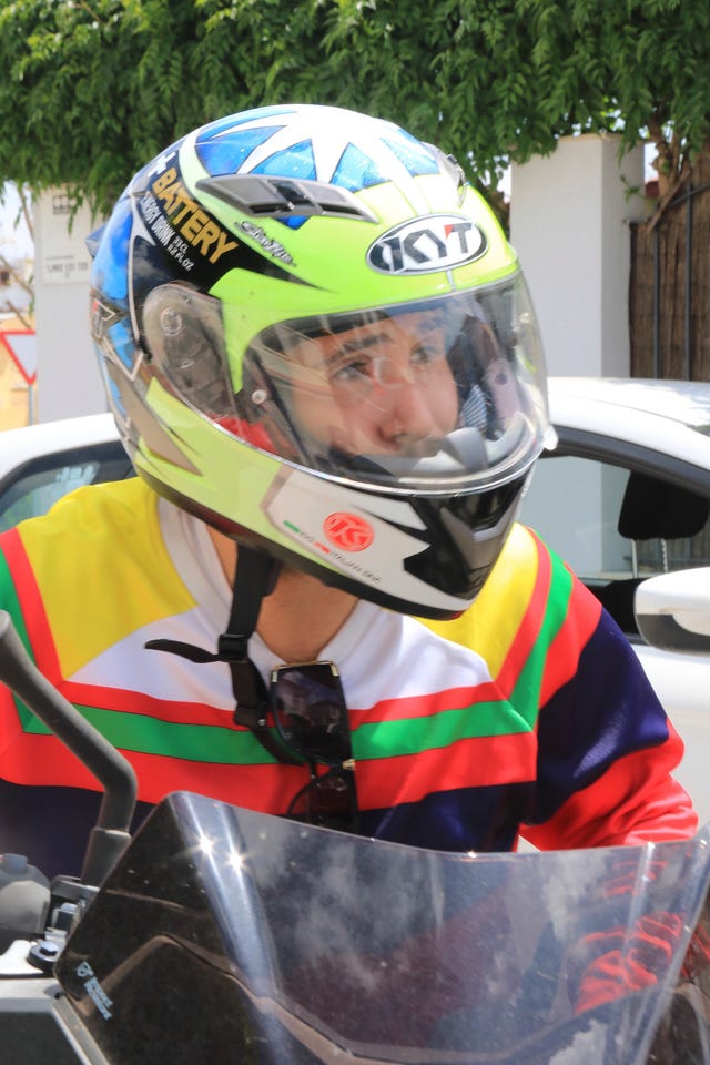 Motorcycle helmet, Helmet, Personal protective equipment, Clothing, Headgear, Vehicle, Sports equipment, Sports gear, Kart racing, Motorcycle, 