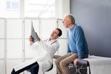 doctor discussing mrt image with patient in medical practice