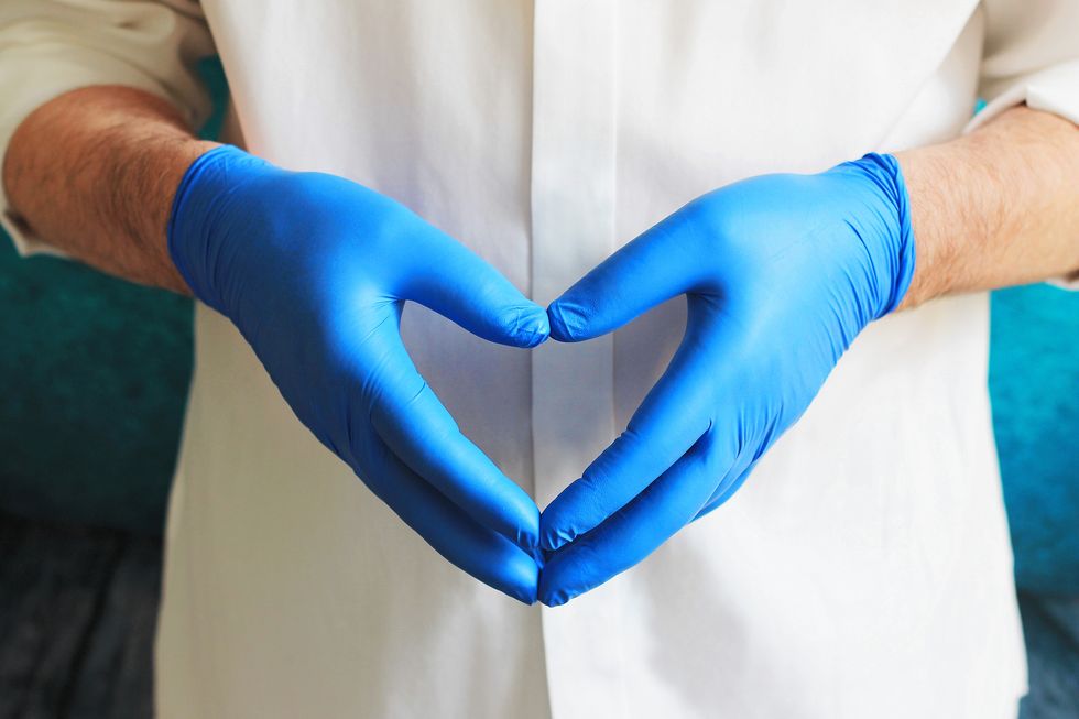 doctor wearing blue latex gloves