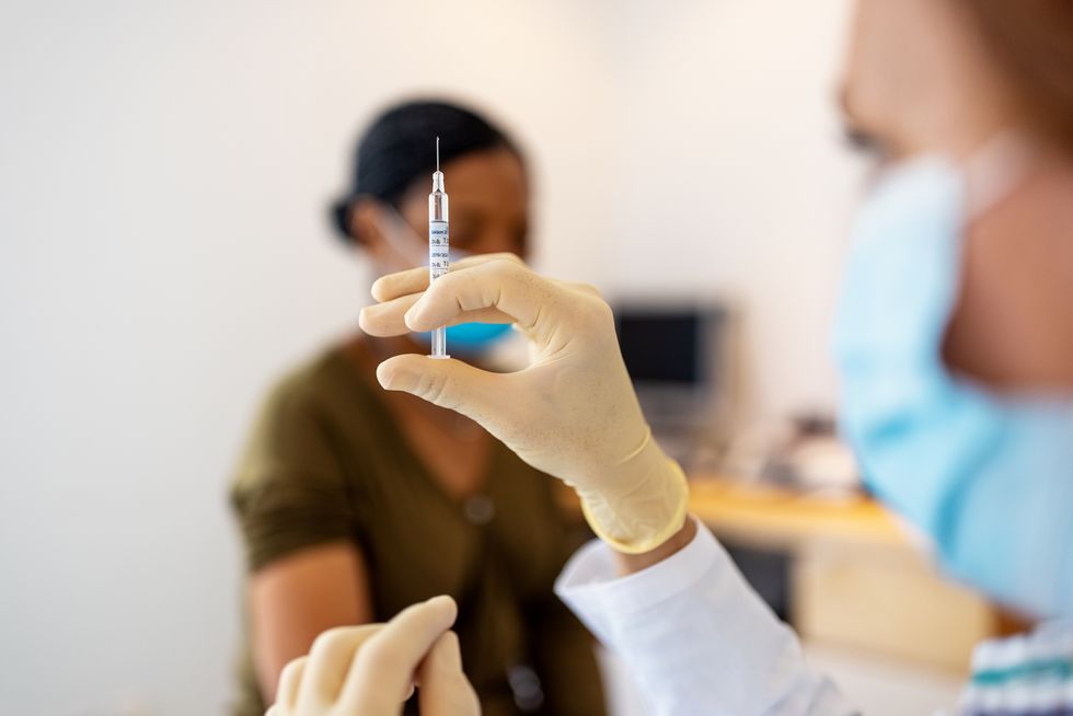 doctor preparing flu or coronavirus injection