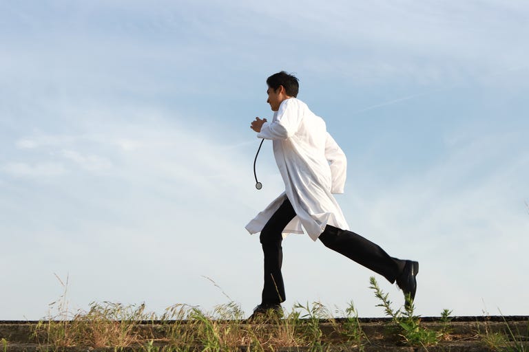Doctor running, side view