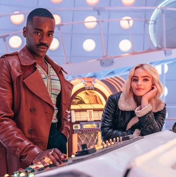 doctor who stars ncuti gatwa and millie gibson in the tardis, with the doctor's diner style jukebox in the background behind them