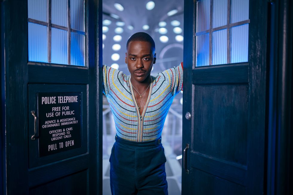 ncuti gatwa as the fifteenth doctor, standing in between the open doors of the tardis in a scene from doctor who
