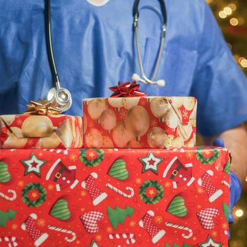 doctor with christmas gifts box