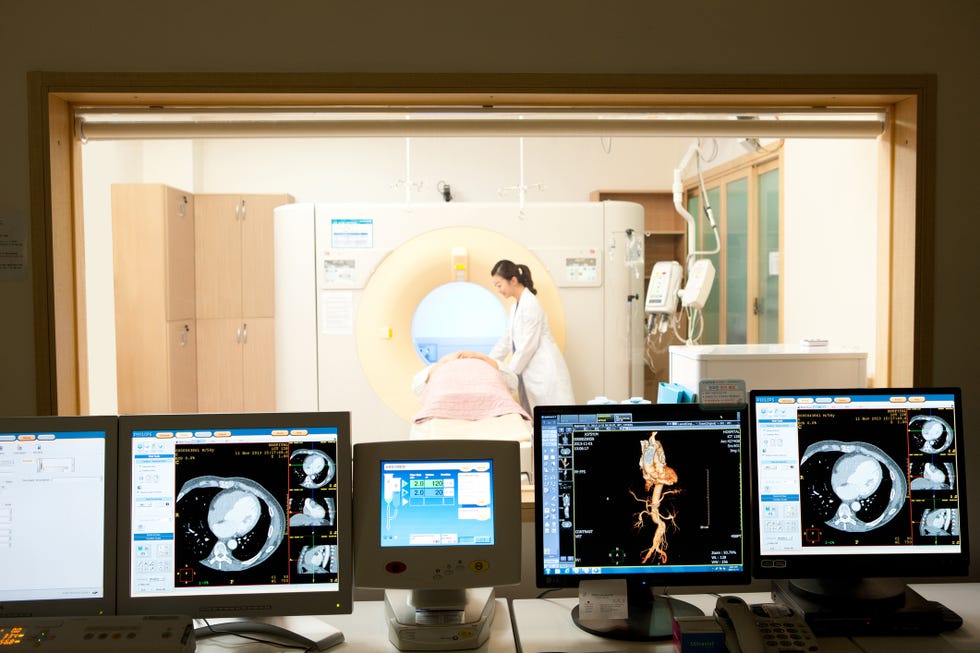 Doctors filming middle-aged man