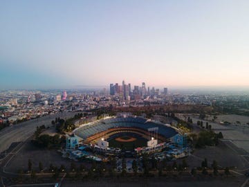 built into the slopes of a mountain, with sweeping views of los angeles from downtown to the hollywood sign and beyond, dodger stadium offers a definitive perspective on the city