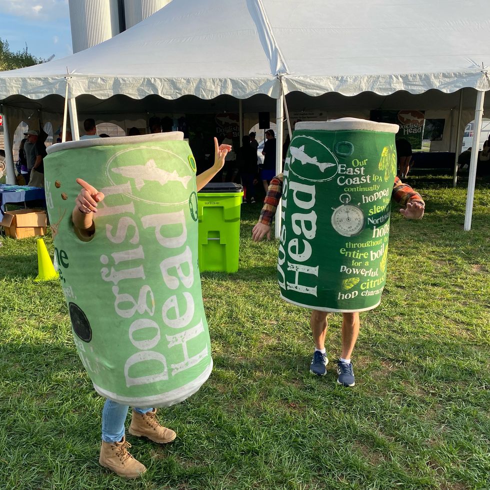 two mascots dressed as dogfish beer cans