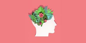 think green, paper craft head made with paper with plants and flowers growing in there on red background