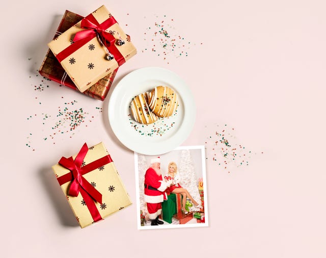 fresh cookies on a plate, and christmas presents on white background