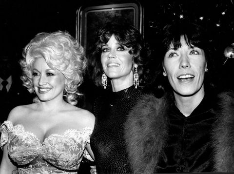 black and white photo of dolly parton, jane fonda and lily tomlin on 9 to 5 red carpet