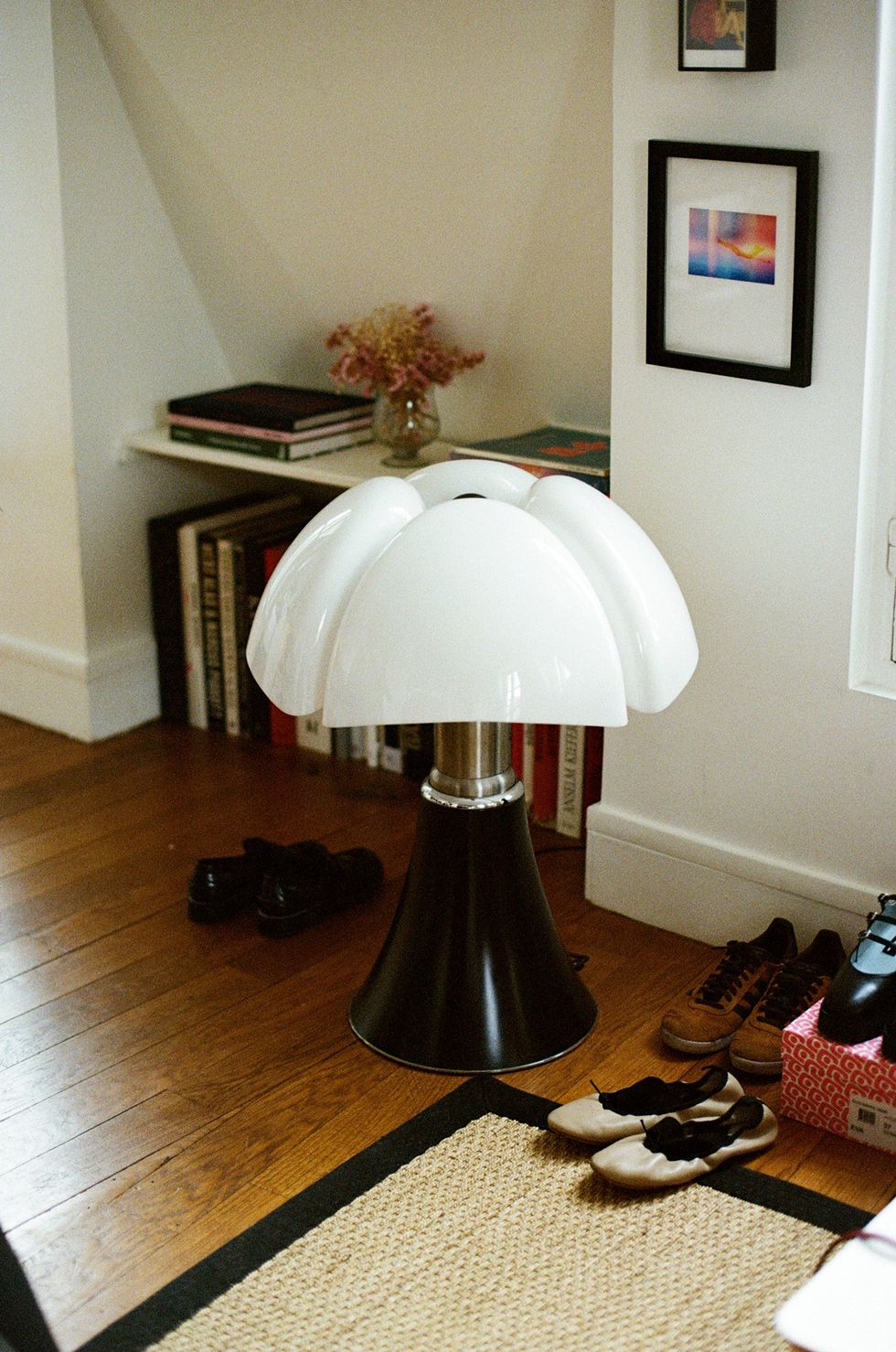 a lamp on a wood floor
