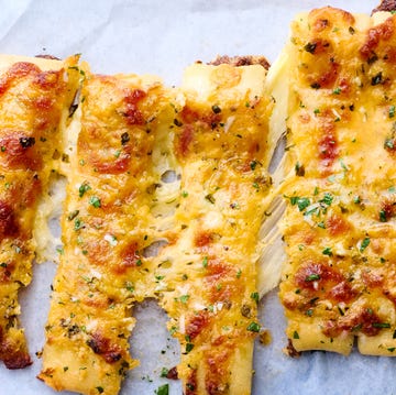 Copycat Domino’s Stuffed Cheesy Bread stuffed cheesy bread cut into breadsticks