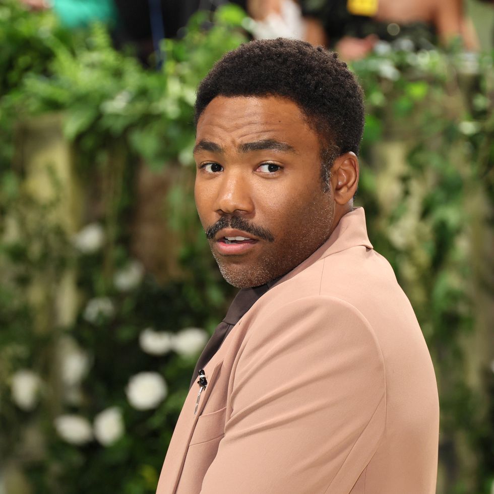 donald glover looking to his left and doing a fashion pose