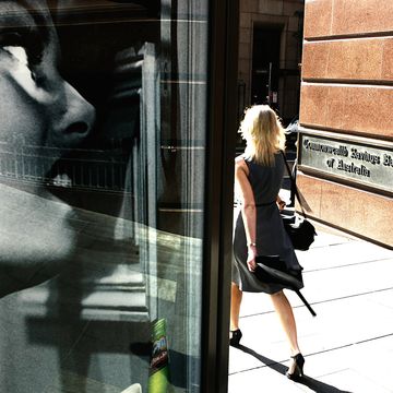 A woman walks past the Commonwealth Bank in Martin Place, Sydney, 28 November 20