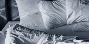 White, Bed sheet, Black-and-white, Textile, Bedding, Linens, Comfort, Furniture, Leg, Room, 