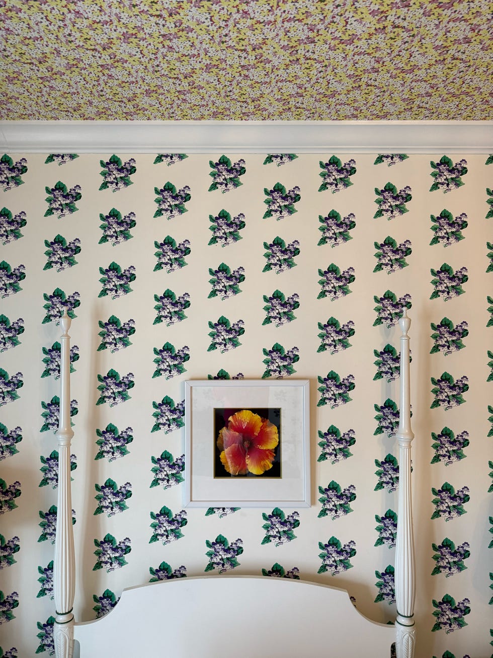 bedroom with floral wallpaper on walls and ceiling