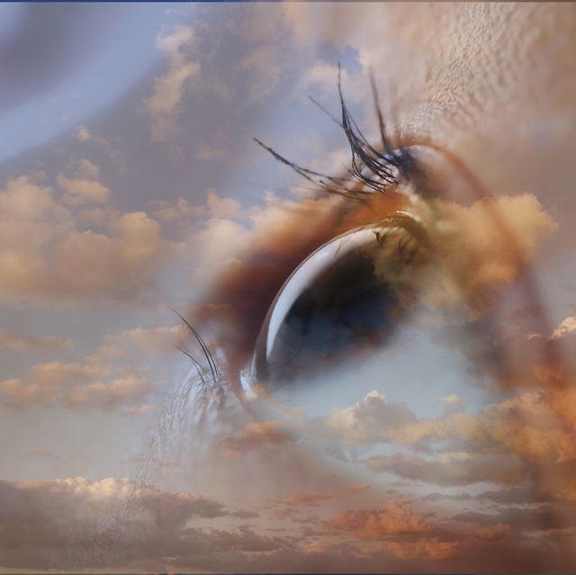 double exposure of eye and cloudy sky