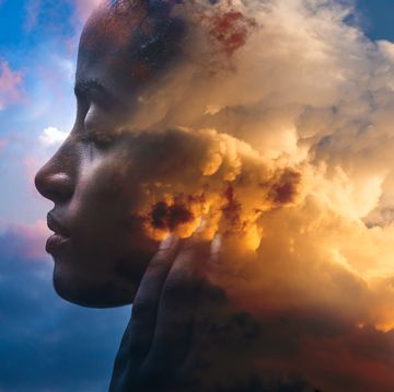 double exposure portrait of a dark skinned woman and a striking sunset